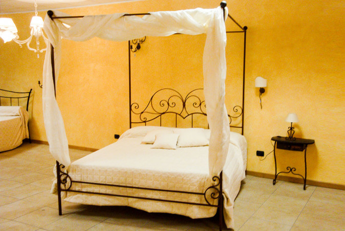 Elegant hand-forged wrought iron canopy bed - Buy Properzio four-poster by Artigianfer Spello