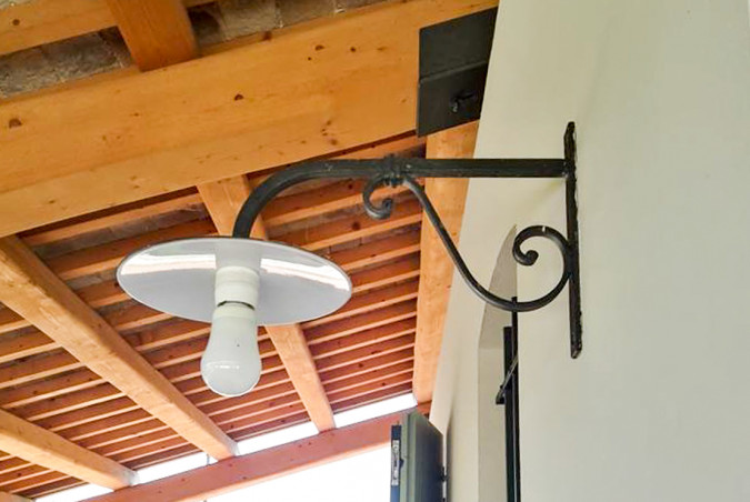 Hand-forged wrought iron outdoor wall light with arm for front porch - Buy Este by Artigianfer Spello Italy
