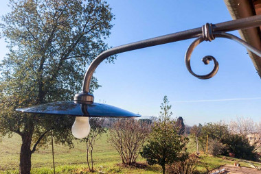 Hand-forged wrought iron outdoor long arm wall light with double swirl workmanship - Buy Este by Artigianfer Spello Italy