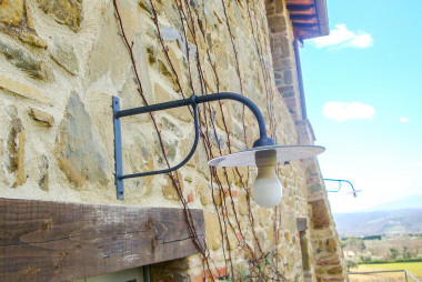 Wrought iron wall lamps with arm of two lengths - Buy outdoor lighting by Artigianfer Spello Italy